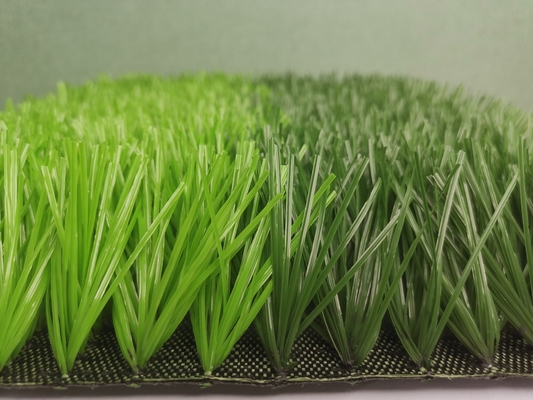 จีน หญ้าประดิษฐ์ 50 มม. สีเขียวทน UV สำหรับสนามฟุตบอล ผู้ผลิต
